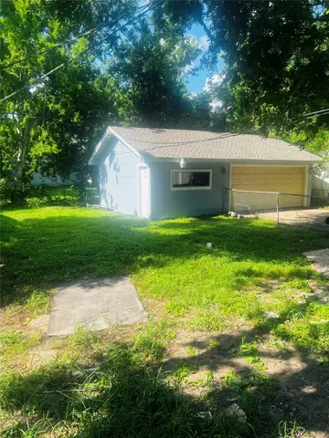 a backyard of a house with lots of green space