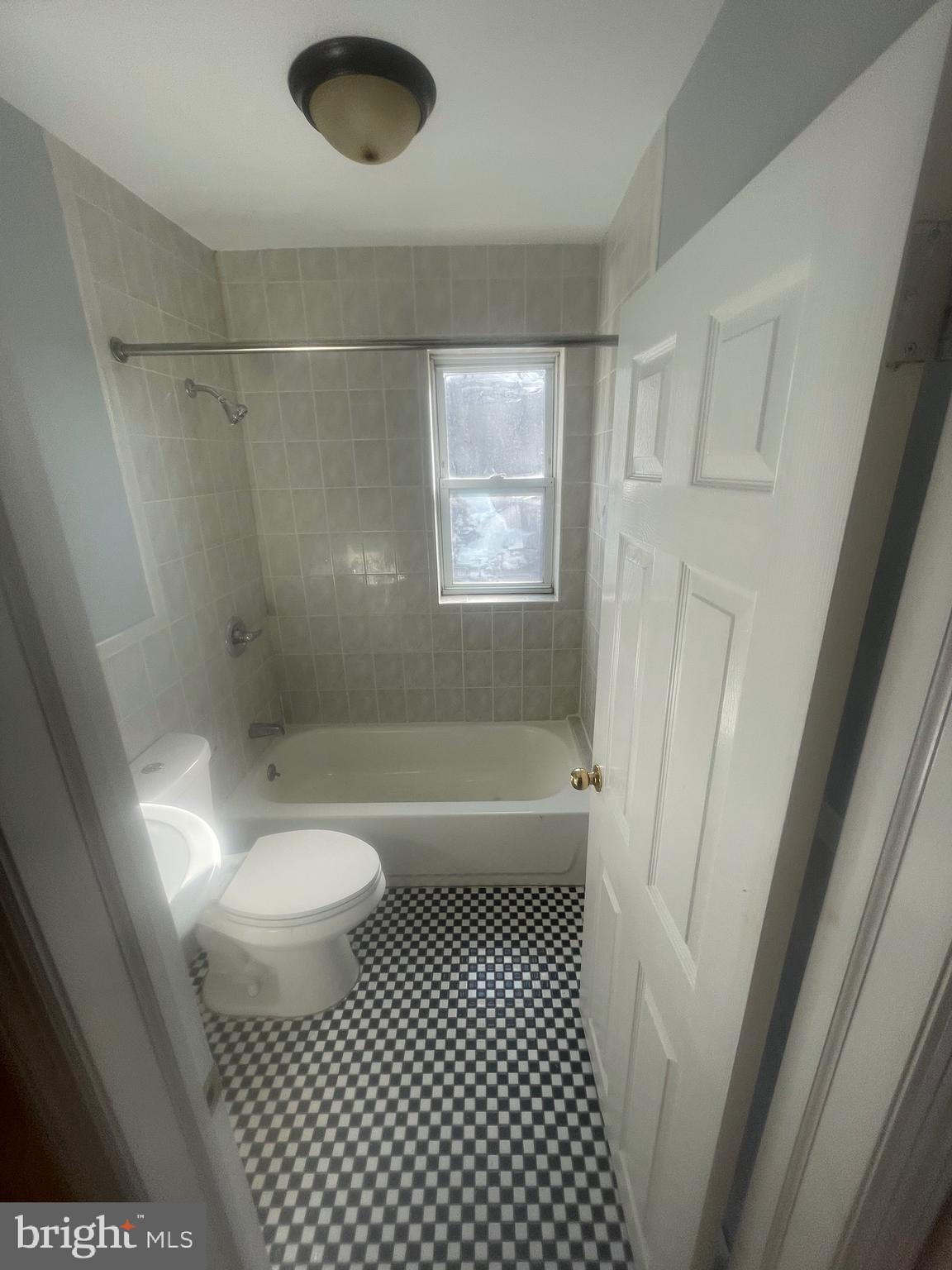 1644 Granite Street Philadelphia, PA 19124 - Photo 7 of 21 a bathroom with a sink a toilet a window and a shower