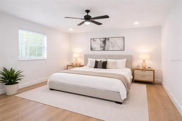 a bedroom with bed and window