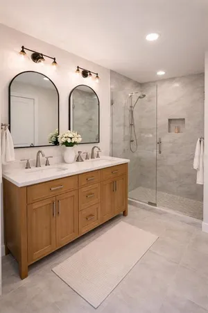 a bathroom with a double vanity sink mirror and shower