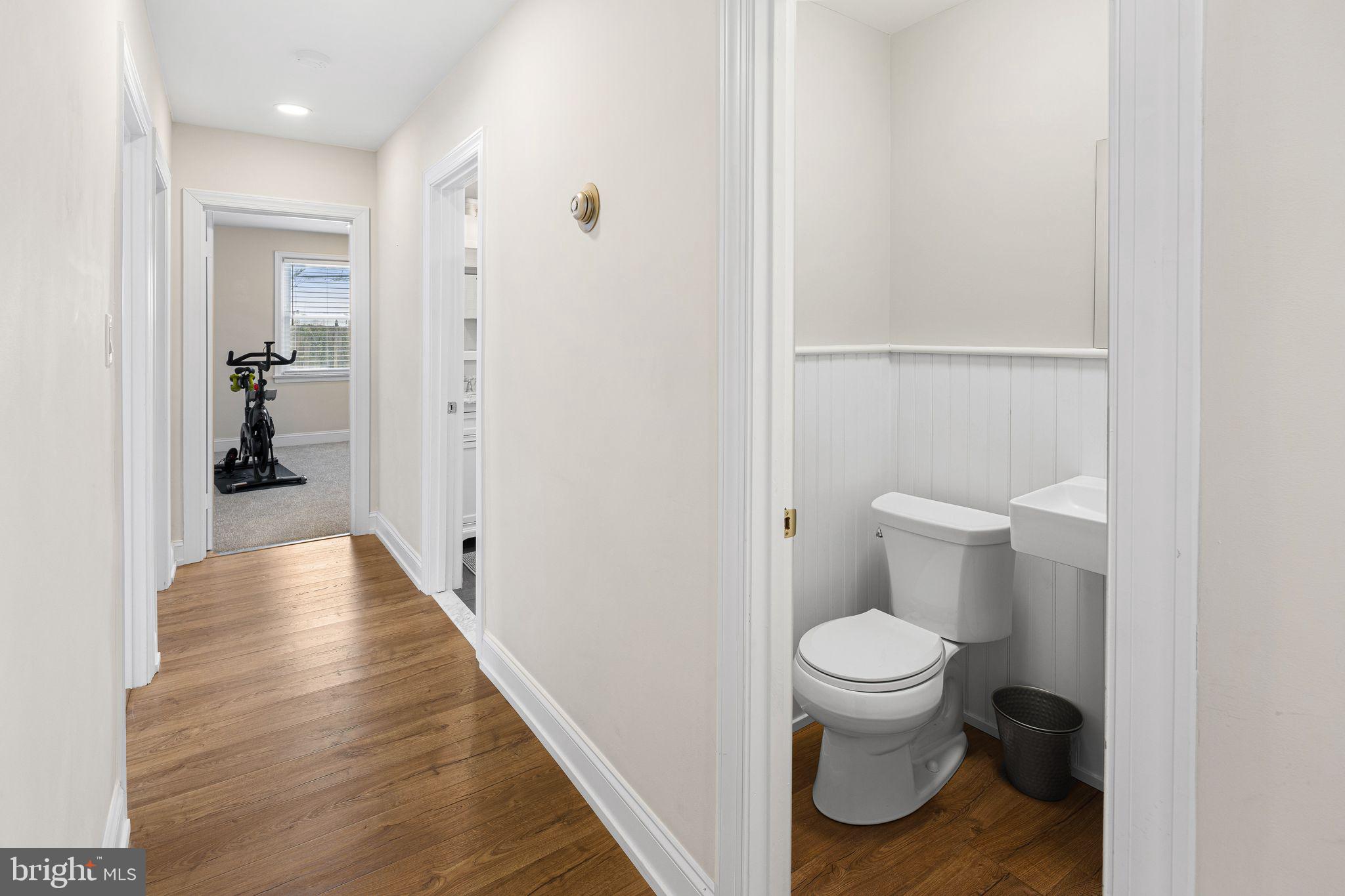 910 Edann Road Oreland, PA 19075 - Photo 16 of 26 a bathroom view of a toilet and a hardwood