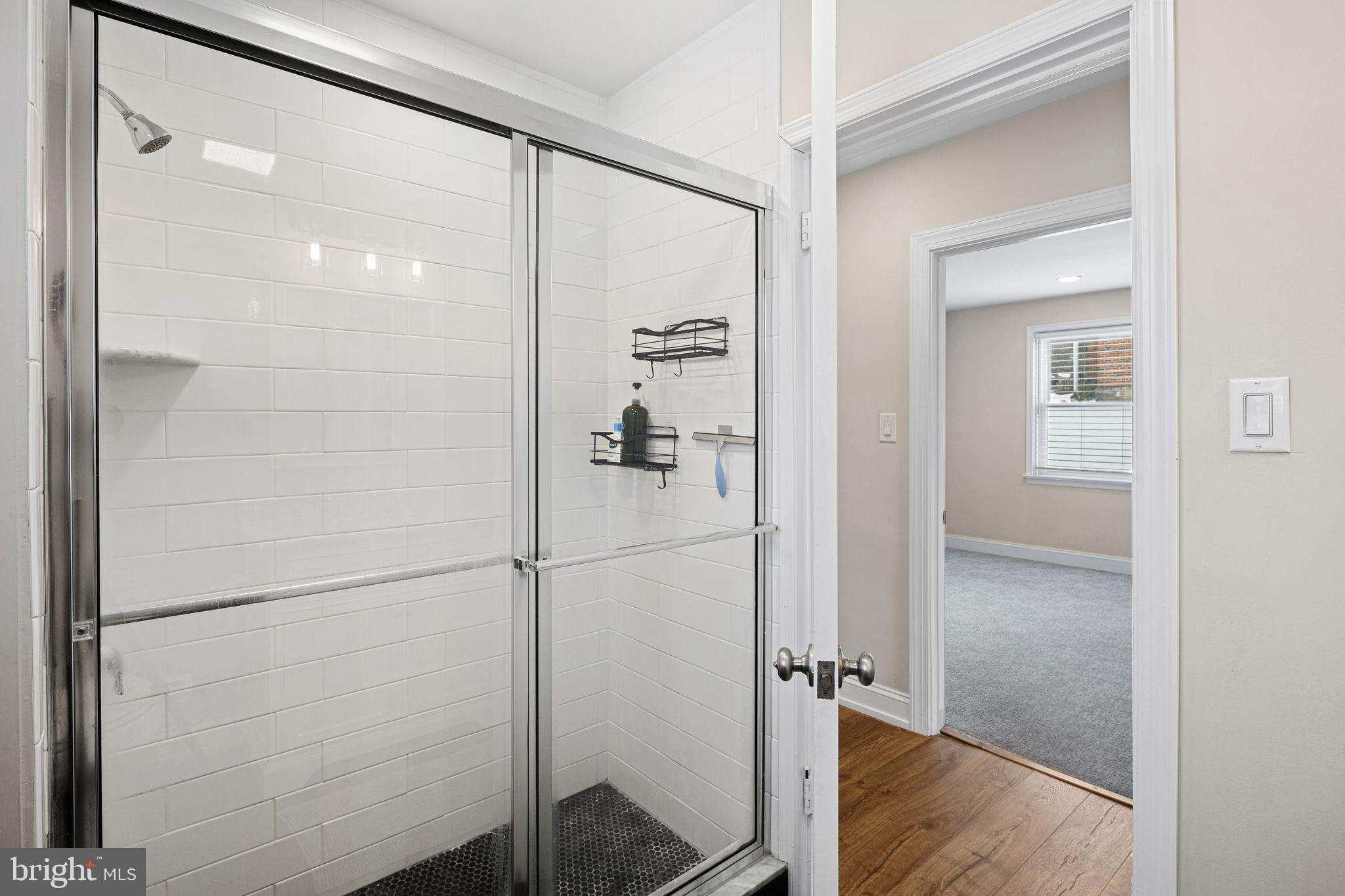 910 Edann Road Oreland, PA 19075 - Photo 21 of 26 a bathroom with a glass shower door