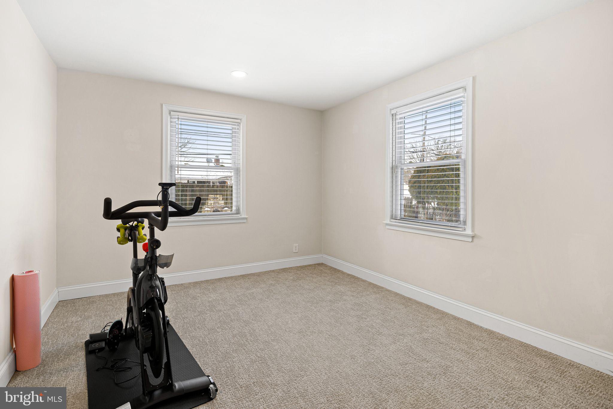 910 Edann Road Oreland, PA 19075 - Photo 23 of 26 a room with gym equipment and a window