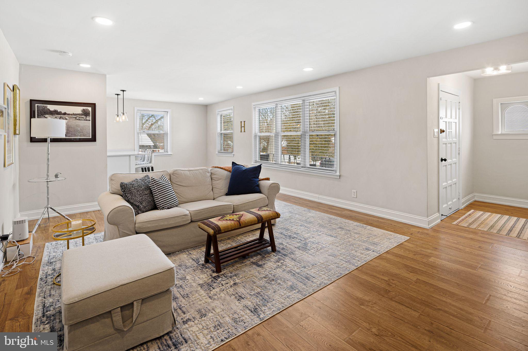 910 Edann Road Oreland, PA 19075 - Photo 7 of 26 a living room with furniture and a window