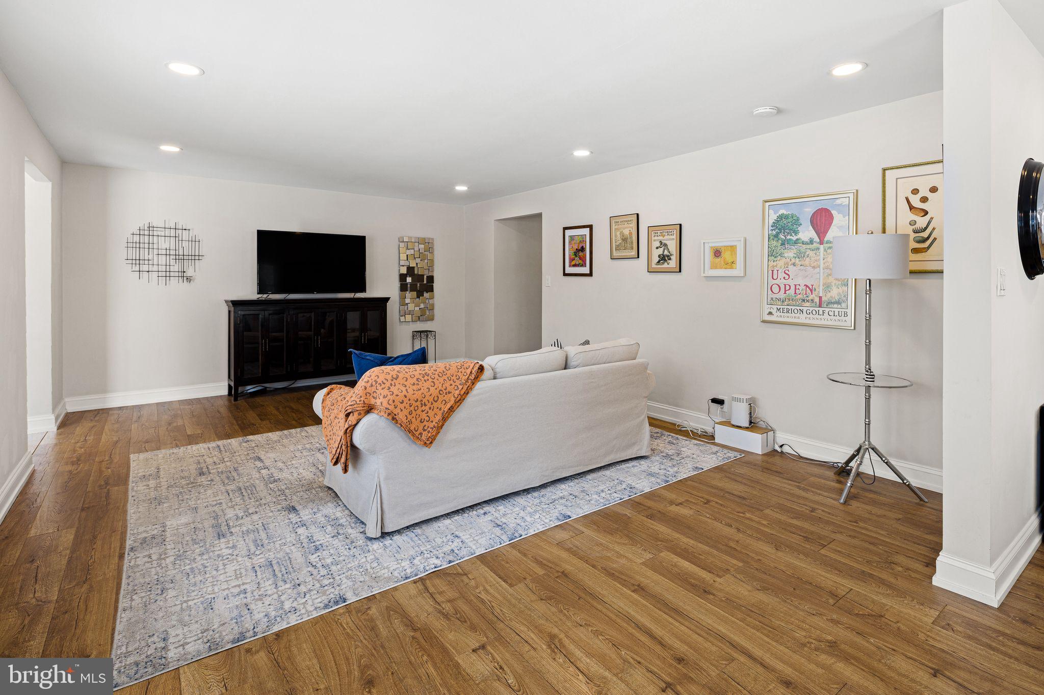 910 Edann Road Oreland, PA 19075 - Photo 8 of 26 a spacious bedroom with a bed and a flat screen tv