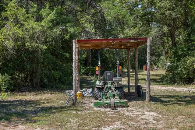 a kitchen with stainless steel appliances granite countertop a sink refrigerator and cabinets