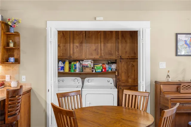 a living room with furniture wooden floor and a fireplace