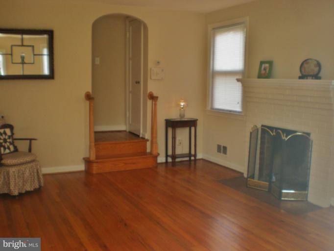 11710 Galt Avenue Silver Spring, MD 20902 - Photo 12 of 25 Living Room with Fireplace & Hardwood Floors