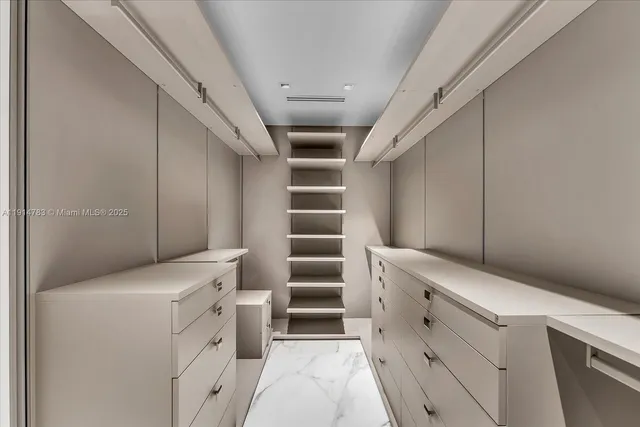 a view of storage and utility room with washer and dryer