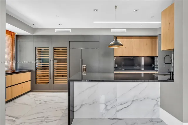 a view of a kitchen with a sink and a stove top oven