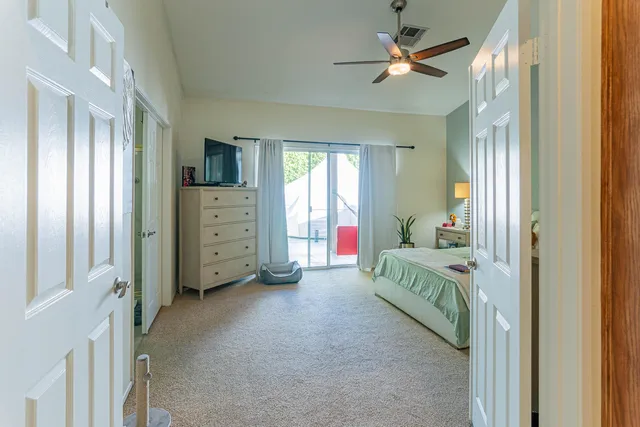 a bed room with a bed and a window