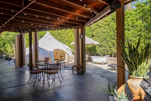 a view of balcony with furniture