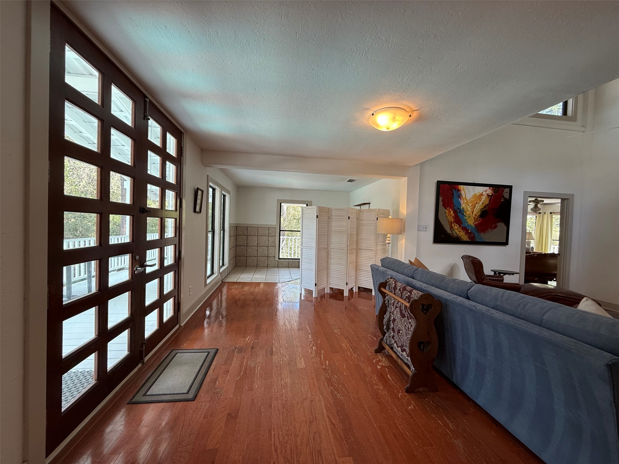 363 Porter Road Bastrop, TX 78602 - Photo 37 of 37 Polished hardwood floors and multi-lite french doors define this inviting interior entry space.