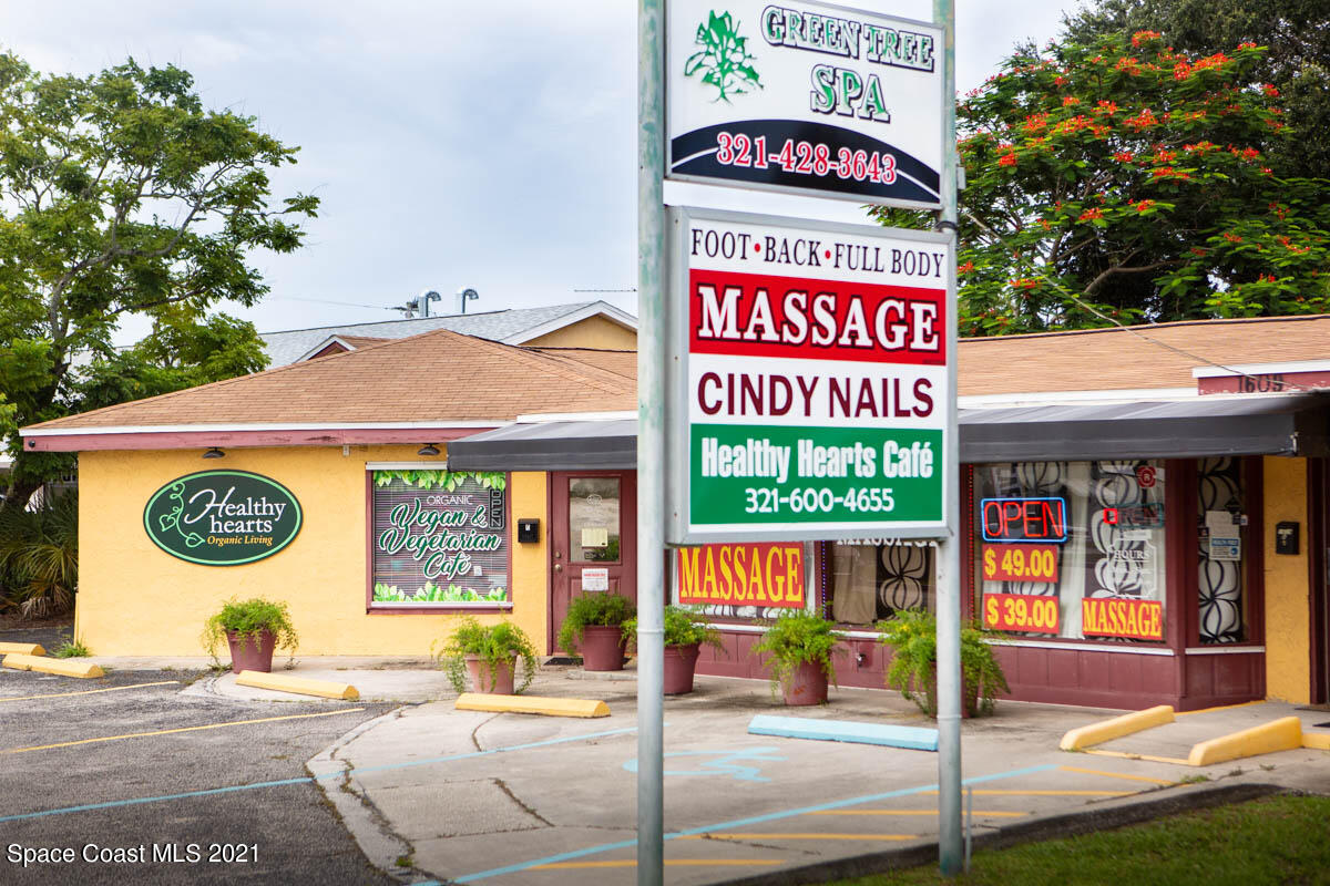 1609 North Wickham Road Melbourne, FL 32935 - Photo 4 of 12 a sign on the side of a building
