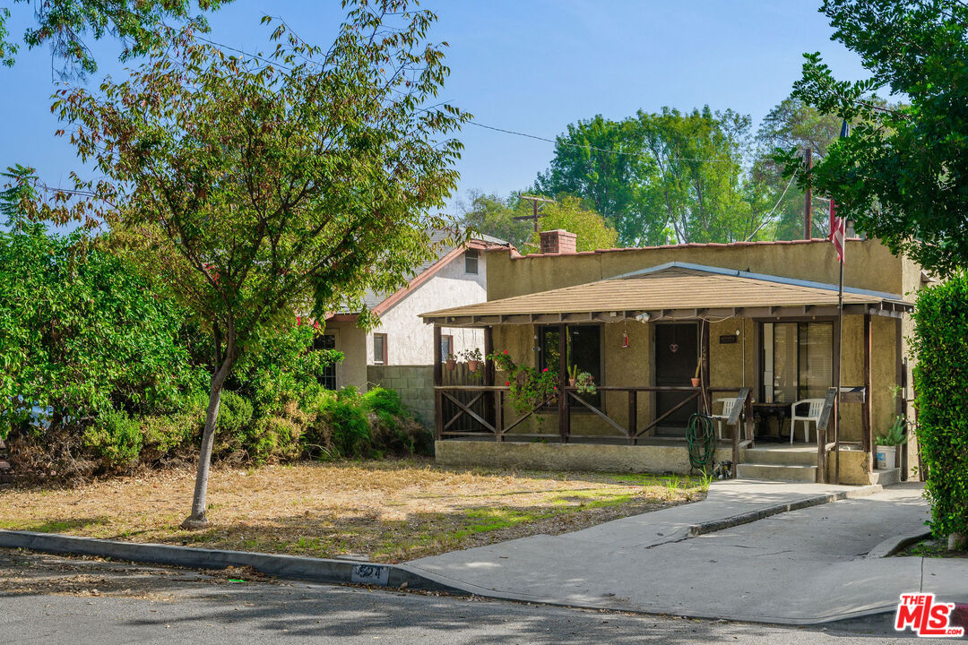 524 Hazel Street Glendale, CA 91201 - Photo 3 of 7 a view of a barn with table and chairs under an umbrella