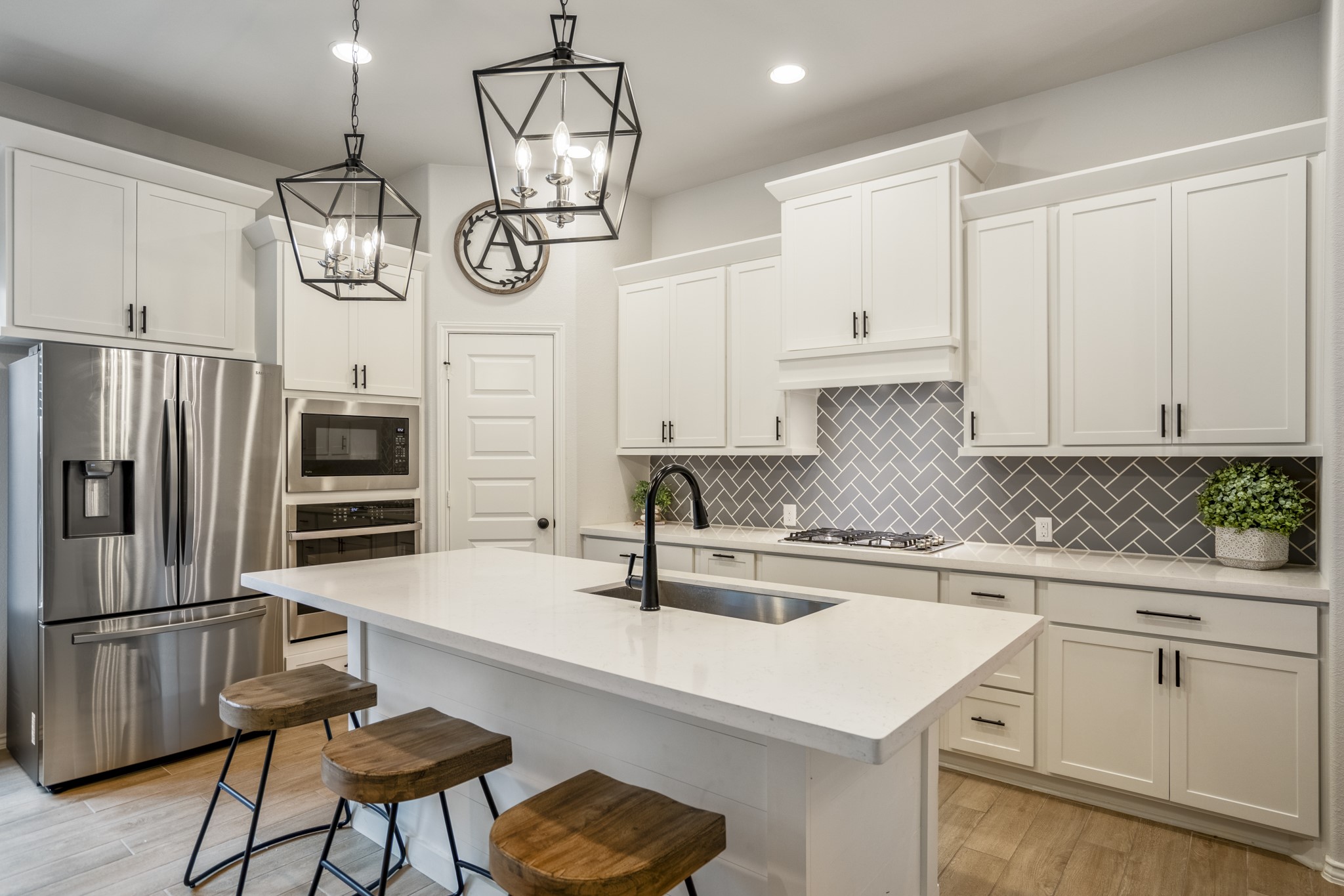 334 Topper Pines Drive Montgomery, TX 77316 - Photo 10 of 49 The spacious kitchen provides ample storage with it's many cabinets, perfect for keeping the space organized and clutter-free. Stainless steel appliances add a touch of elegance, while recessed lights illuminate the room, creating a bright and inviting atmosphere.