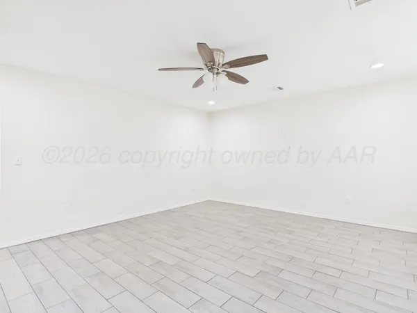 a large kitchen with stainless steel appliances granite countertop a stove a sink and a refrigerator