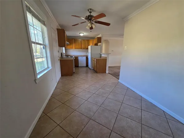 a view of a kitchen with furniture and windows