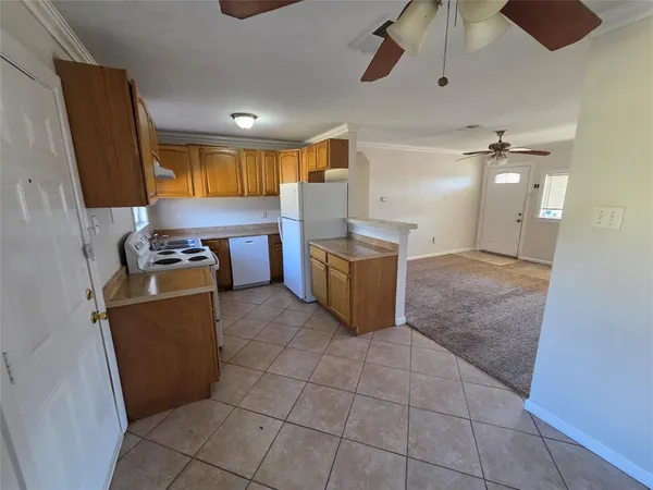 a kitchen with a sink and a refrigerator