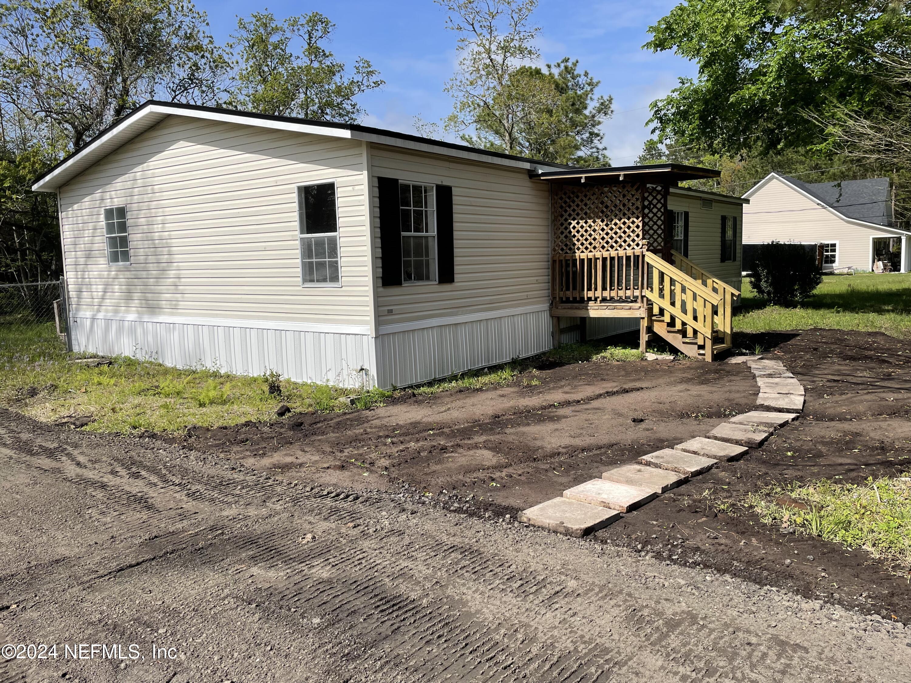 43621 Ratliff Road Callahan, FL 32011 - Photo 1 of 16 a view of a house with a yard