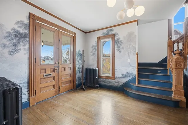 a view of a bedroom with furniture and window