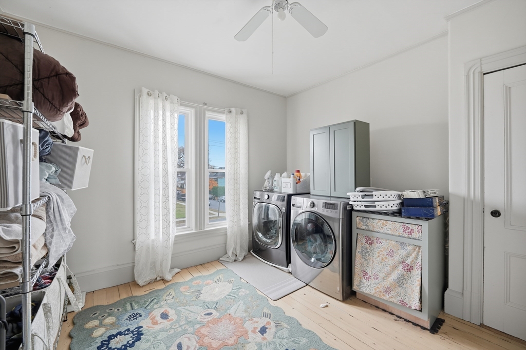 151 Lincoln Street Holyoke, MA 01040 - Photo 20 of 36 a view of a storage and utility room with washer and dryer