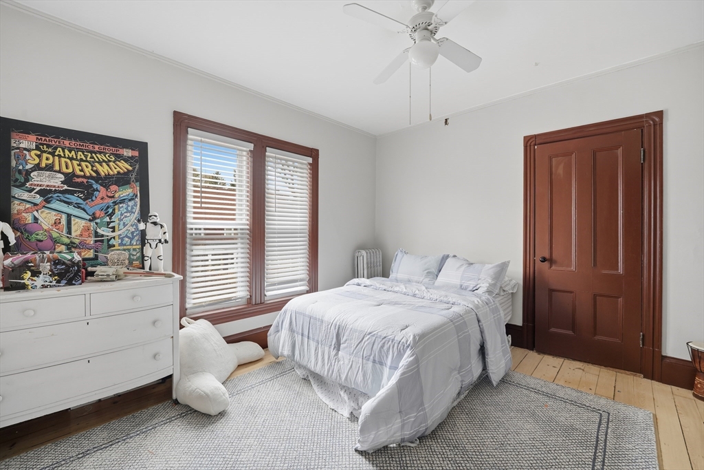 151 Lincoln Street Holyoke, MA 01040 - Photo 21 of 36 a bedroom with a bed and a window
