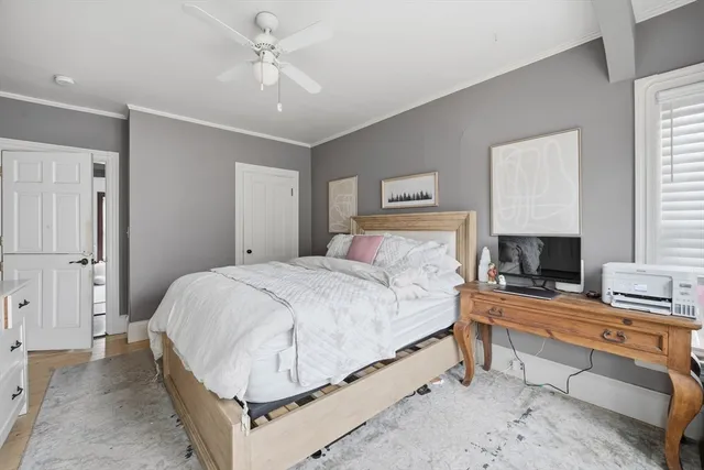 a bedroom with a bed and a fireplace