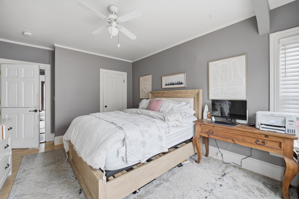 151 Lincoln Street Holyoke, MA 01040 - Photo 24 of 36 a bedroom with a bed and a fireplace