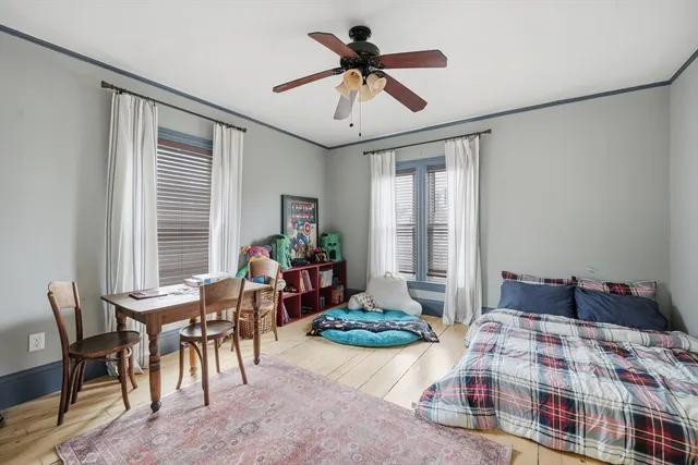 a bedroom with bed and a window