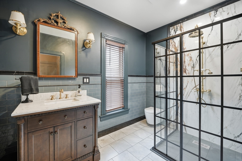 151 Lincoln Street Holyoke, MA 01040 - Photo 28 of 36 a bathroom with a sink and a mirror