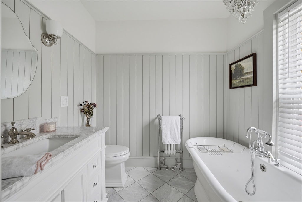 151 Lincoln Street Holyoke, MA 01040 - Photo 31 of 36 a bathroom with a sink a toilet and shower