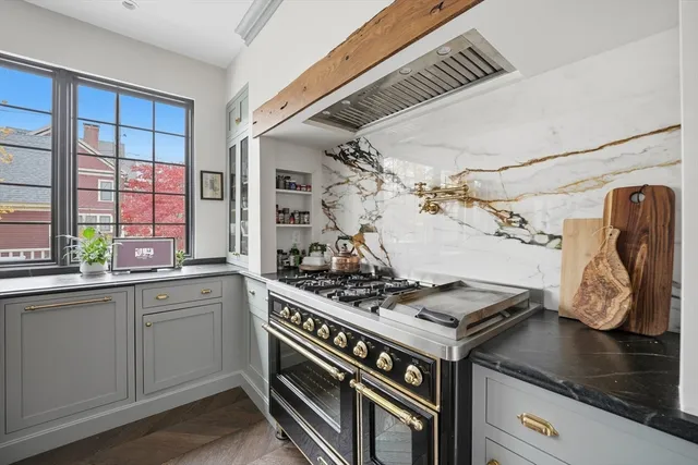 a kitchen with a stove and a sink