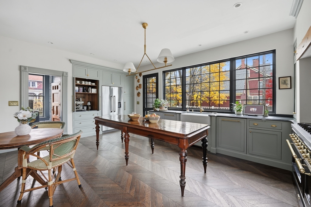 151 Lincoln Street Holyoke, MA 01040 - Photo 7 of 36 a room with a table chairs and a kitchen view