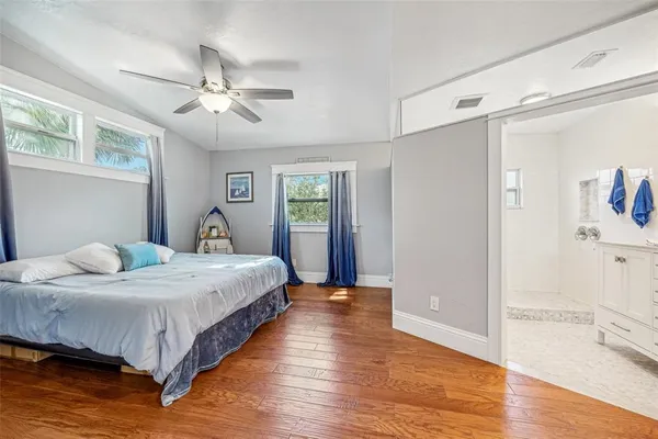 a bedroom with bed and window