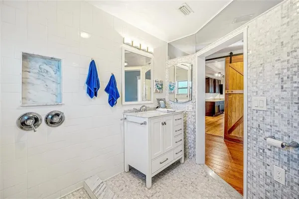 a bathroom with a sink and a mirror