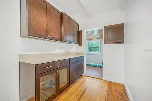 a kitchen with a sink and cabinets