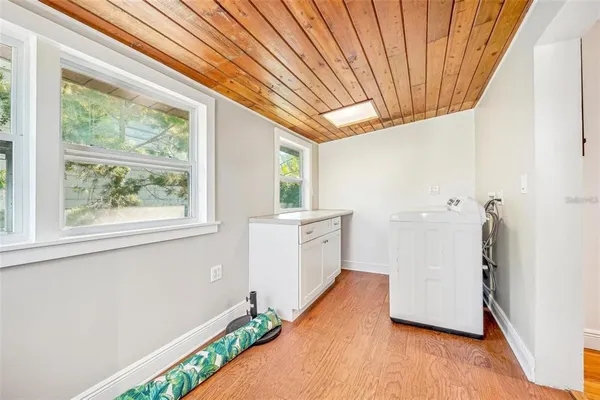 a bathroom with a sink and a large window