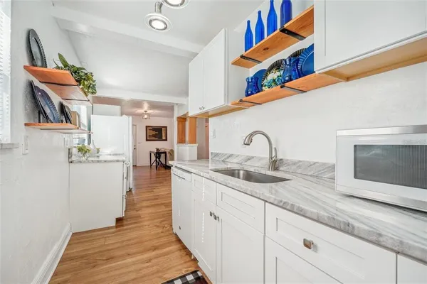 a kitchen with a stove and a sink