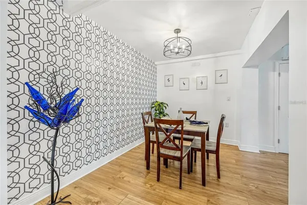 a view of a dining room with furniture and wooden floor