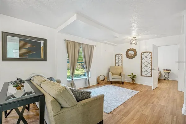 a living room with furniture and a large window