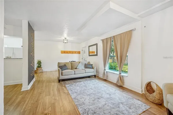 a bedroom with a bed and a potted plant