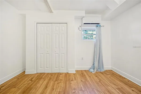 a view of an entryway with wooden floor