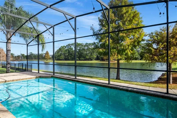 a view of a swimming pool with a porch
