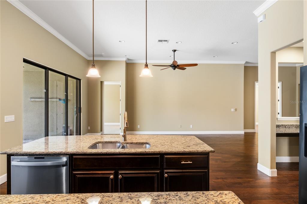 7167 Beek Street Windermere, FL 34786 - Photo 14 of 63 a bathroom with a granite countertop sink a mirror and shower