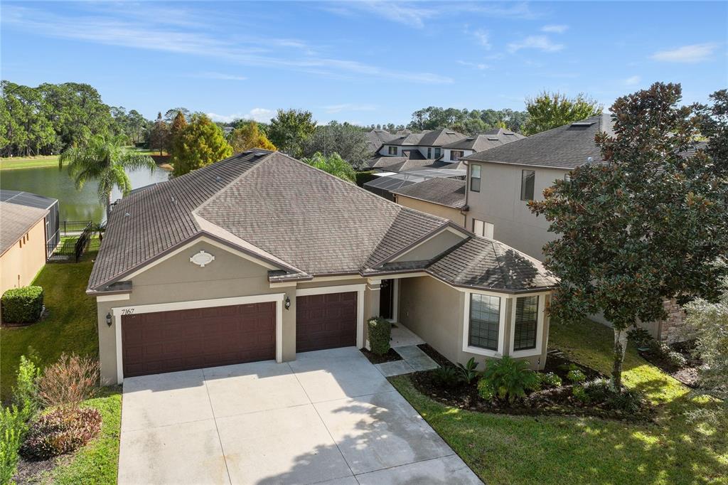 7167 Beek Street Windermere, FL 34786 - Photo 2 of 63 an aerial view of a house with a yard