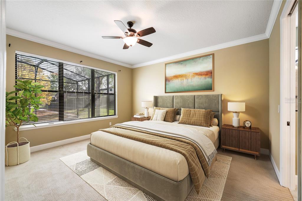 7167 Beek Street Windermere, FL 34786 - Photo 23 of 63 a bedroom with a large bed and a large window