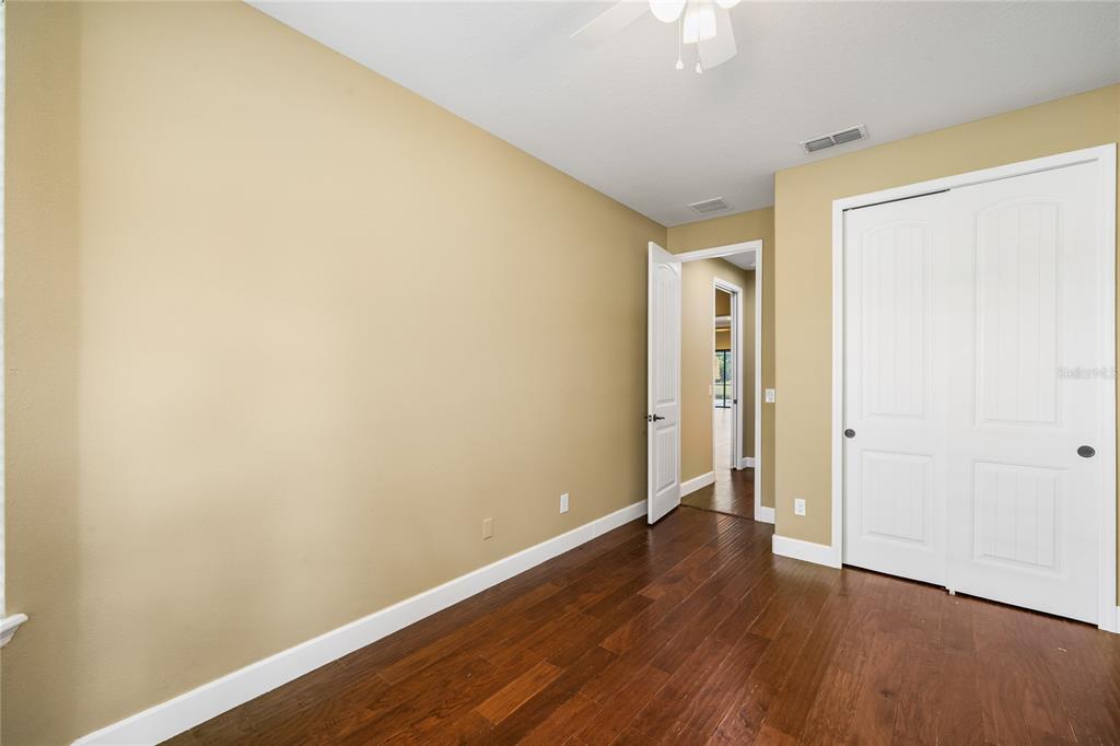 7167 Beek Street Windermere, FL 34786 - Photo 47 of 63 a view of an empty room with wooden floor
