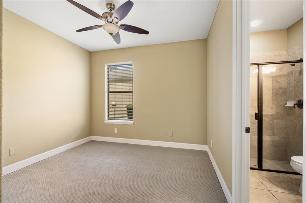 7167 Beek Street Windermere, FL 34786 - Photo 51 of 63 a view of an empty room with closet and a chandelier fan