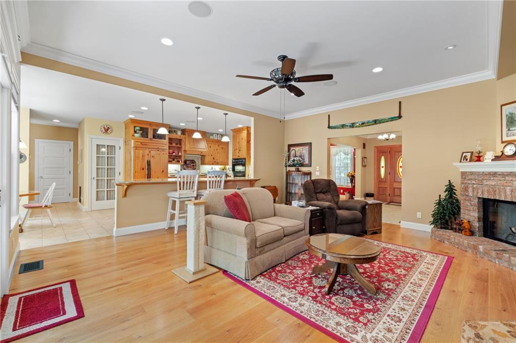 287 Garner Road Edinburg, PA 16116 - Photo 12 of 49 a living room with furniture and a fireplace